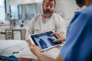 Doctor showing patient chest x-ray